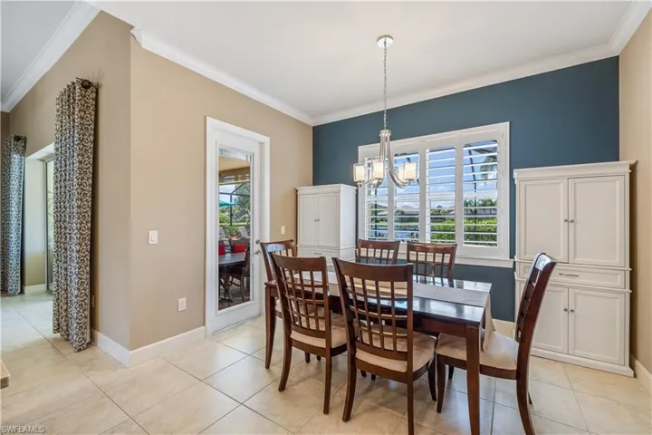Dining area featuring crown molding, and tile throughout