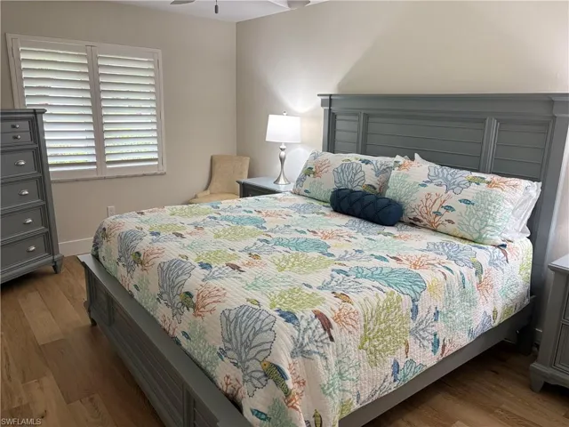 Bedroom featuring light wood-type flooring and a ceiling fan