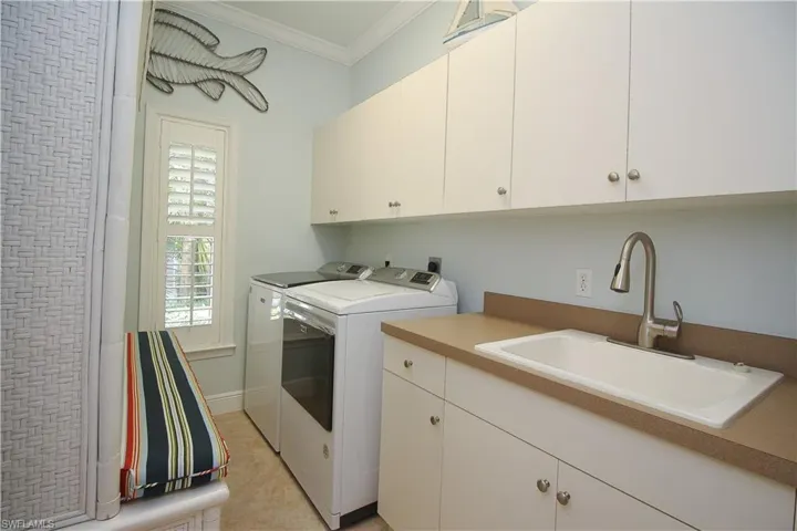 Laundry Room with Deep Sink and Storage Cabinets