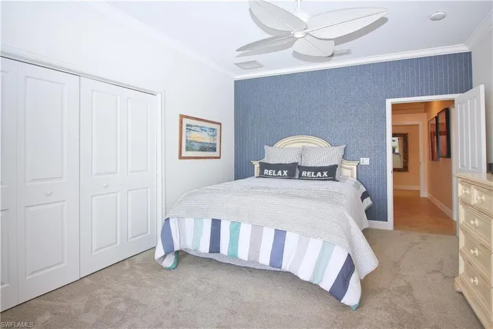 Secondary bedroom with lake views and direct pool access