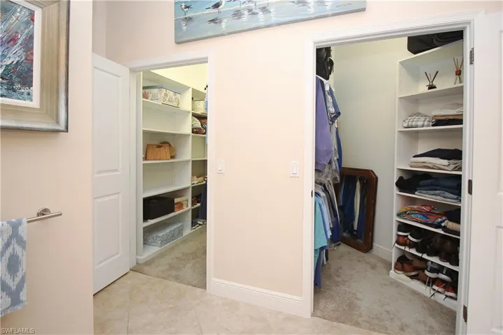 Primary suite with dual walk-in closets