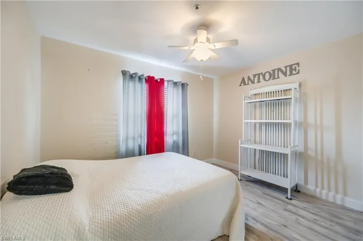 Bedroom featuring wood finished floors and a ceiling fan