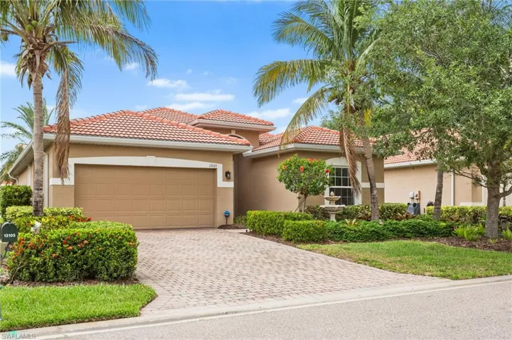 Mediterranean / spanish home with stucco siding, decorative driveway, a tile roof, and an attached garage
