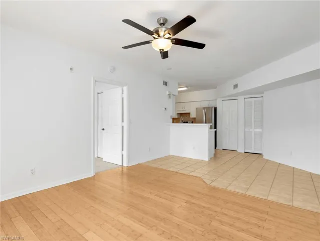 Kitchen with Tile Flooring, White Cabinetry, Stainless Steel Appliances, Tile Backsplash & Pantry - Door To Primary
