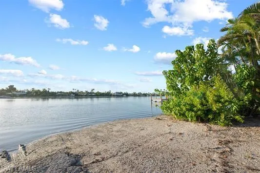 Water view with a boat ramp and a boat dock