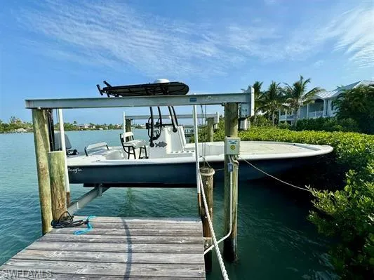 Dock area with a water view and boat lift