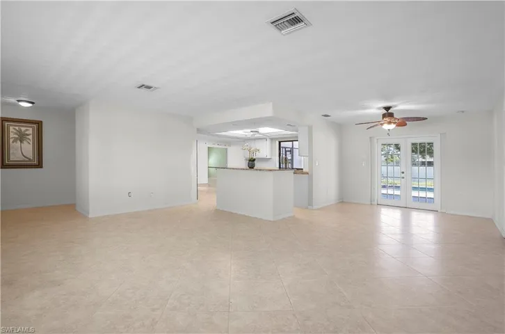 View looking towards the kitchen and back of the home.