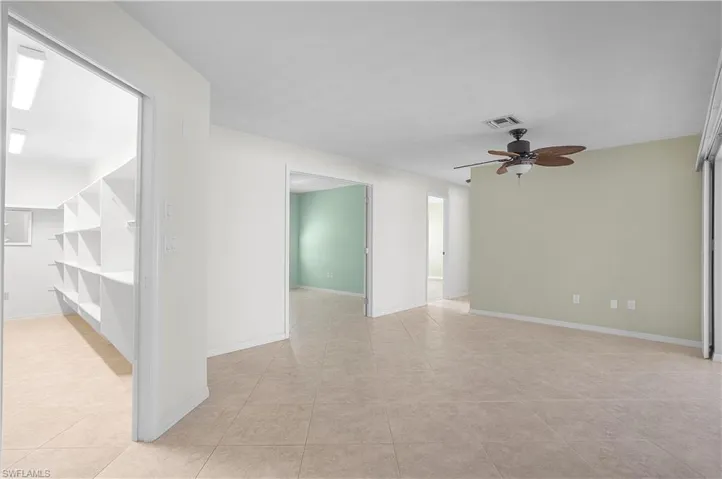 Off the Kitchen, the Dining area overlooks the lanai and backyard with easy slider door access.