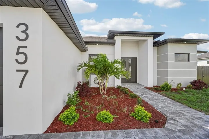 View of exterior entry featuring stucco siding