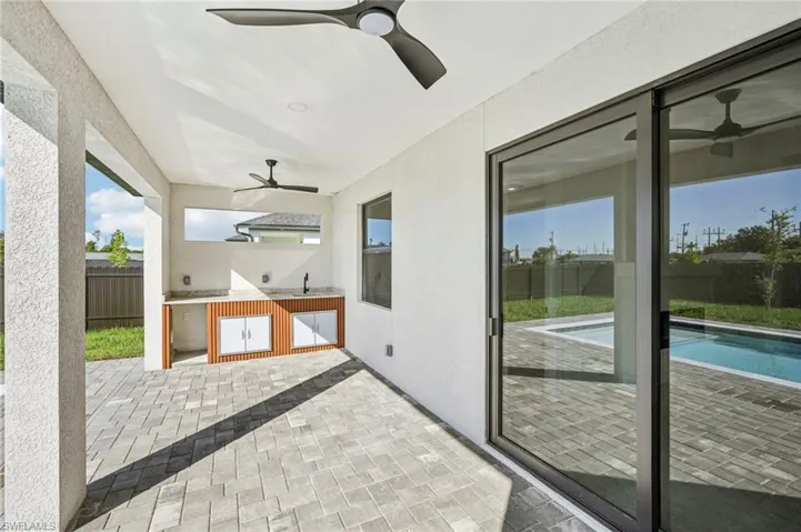 View of patio featuring a ceiling fan