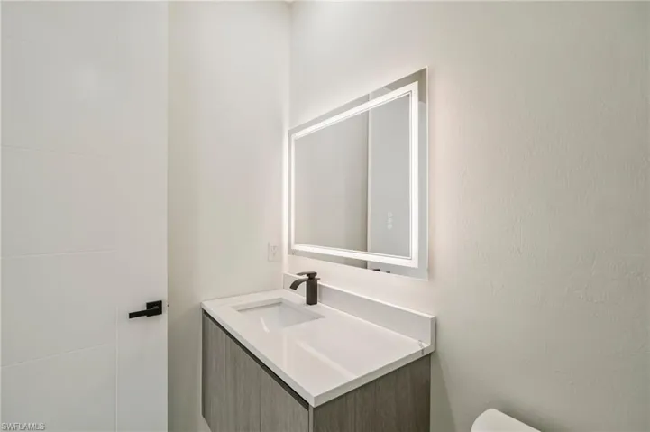 Bathroom featuring vanity and toilet