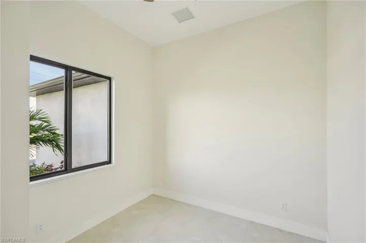 Unfurnished room with baseboards