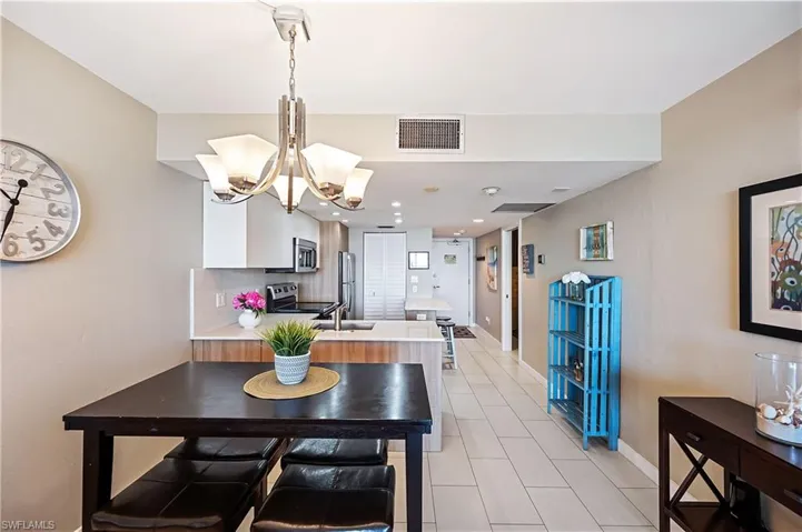 Dining area with sink and a chandelier