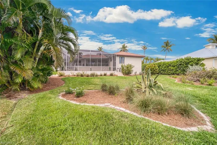 View of yard with a lanai