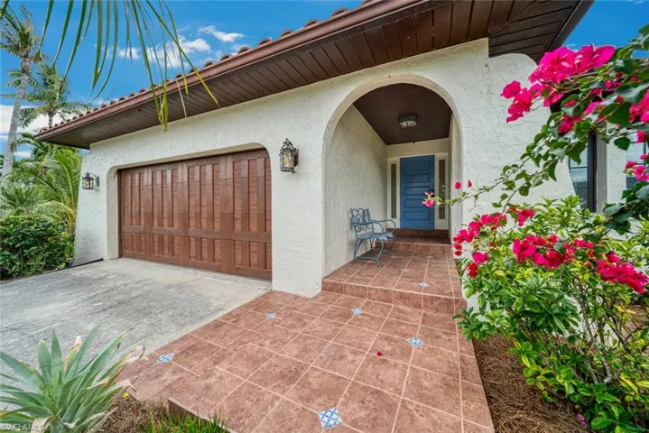 View of exterior entry featuring a garage