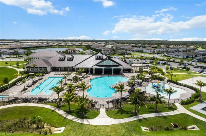 Community pool featuring a residential view, a patio area, and a yard