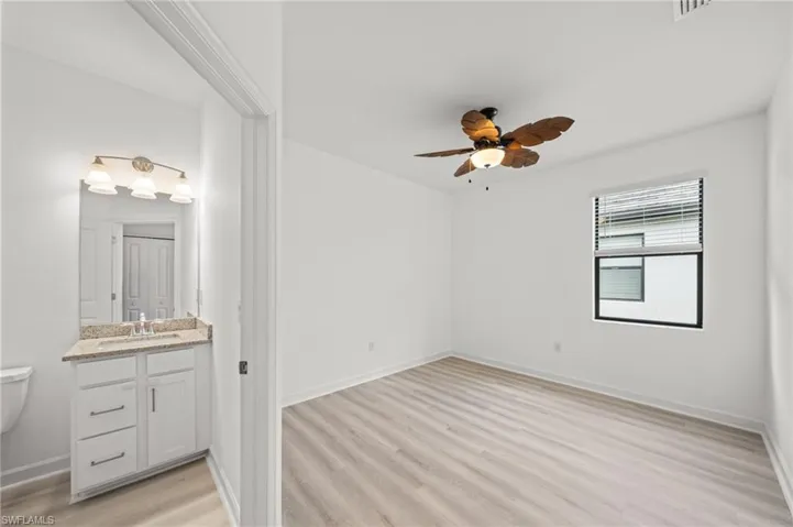 Unfurnished bedroom featuring light wood-style floors and a ceiling fan