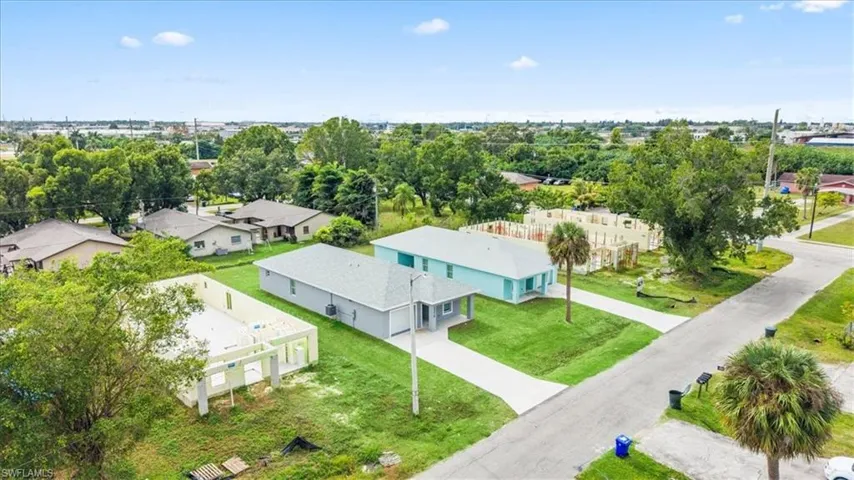Aerial perspective of suburban area featuring a tree filled landscape