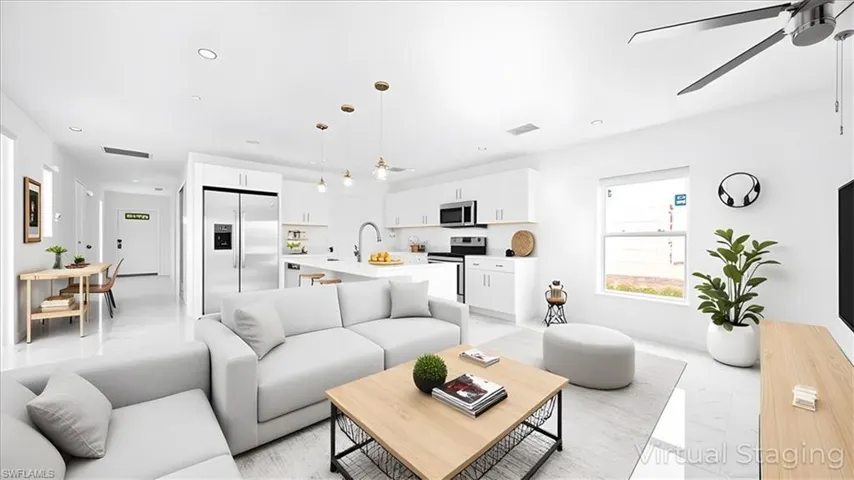 Living area featuring recessed lighting and a ceiling fan