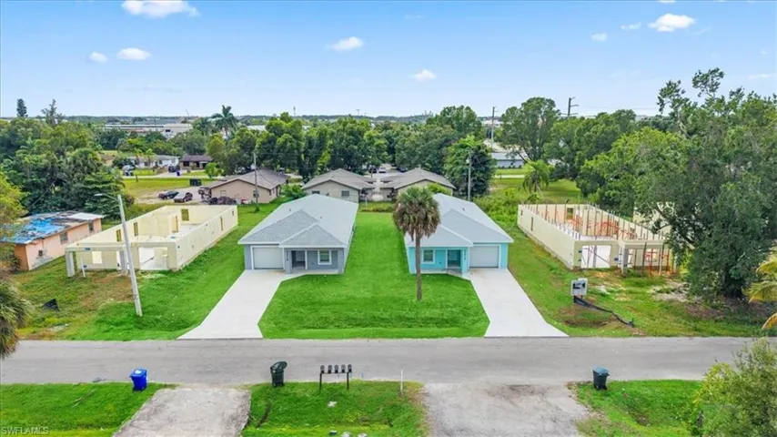 Aerial view of residential area with a tree filled landscape