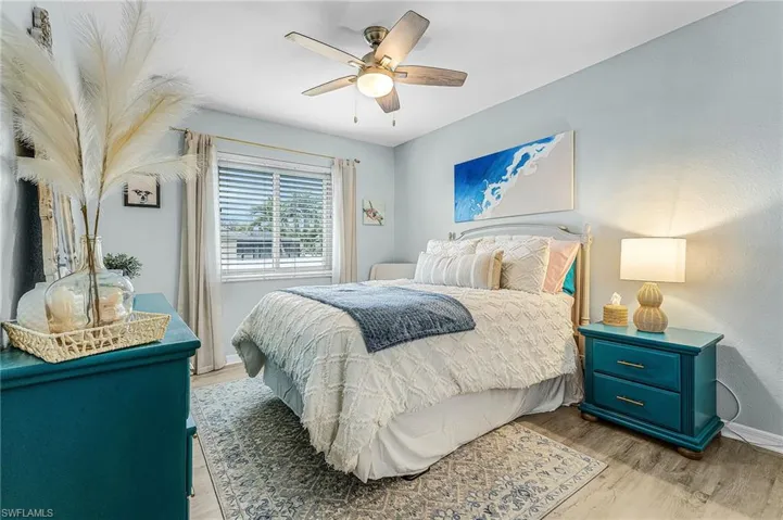 Guest Bedroom #3 featuring light wood-type flooring and a ceiling fan