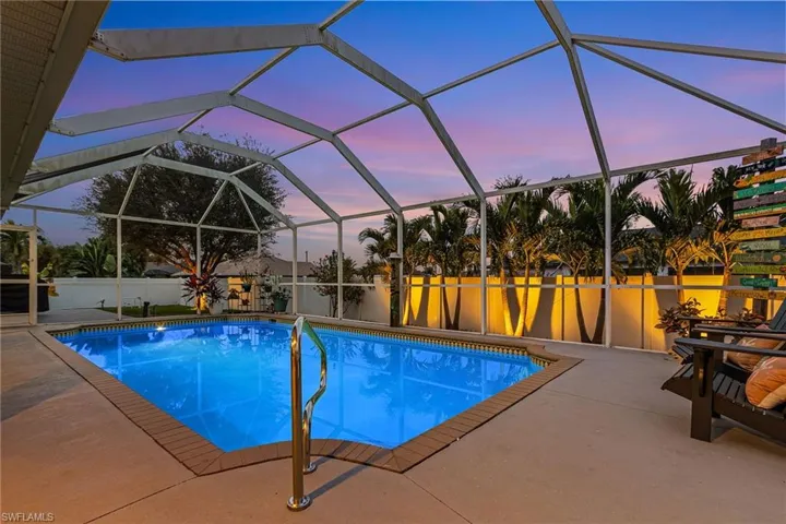 View of pool at dusk