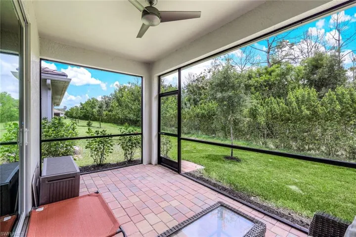 Unfurnished sunroom with ceiling fan