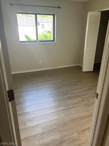 Unfurnished room with light hardwood / wood-style flooring