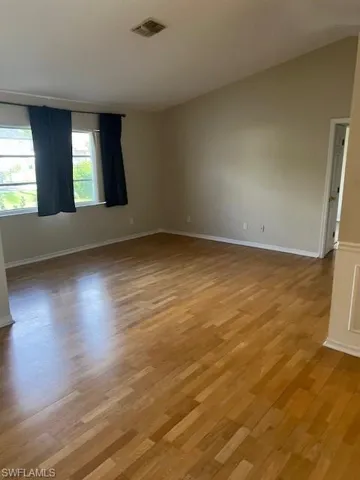 Spare room with light wood-type flooring