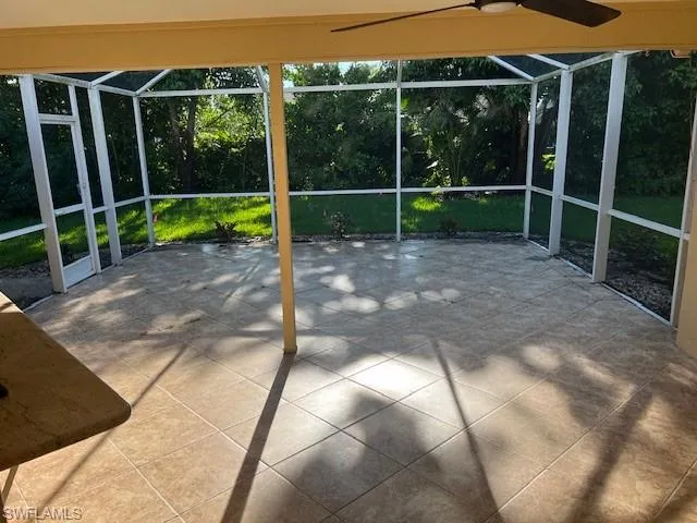 View of patio / terrace featuring glass enclosure