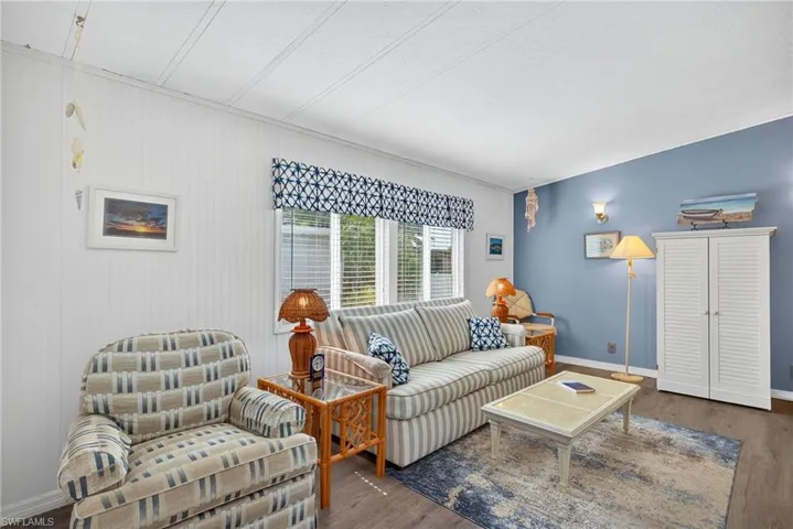 Living area featuring wood finished floors and baseboards