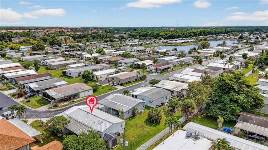 Aerial perspective of suburban area featuring a large body of water