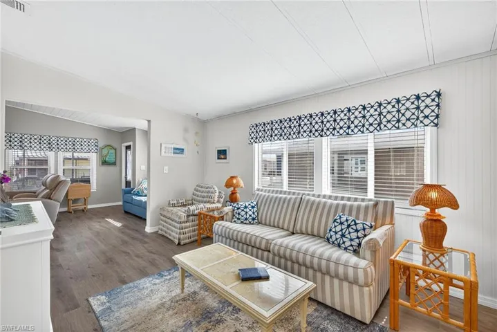 Living room featuring wood finished floors and baseboards