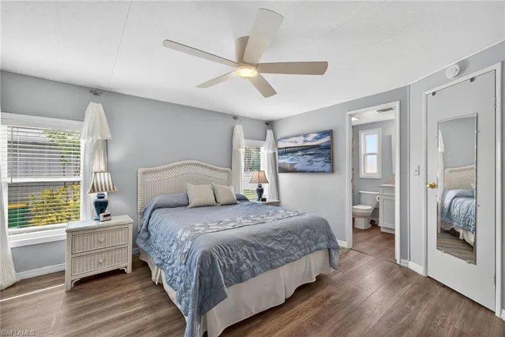 Bedroom featuring wood finished floors and ceiling fan