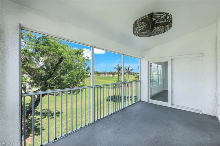Unfurnished sunroom featuring vaulted ceiling