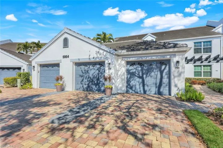 View of front facade featuring a garage