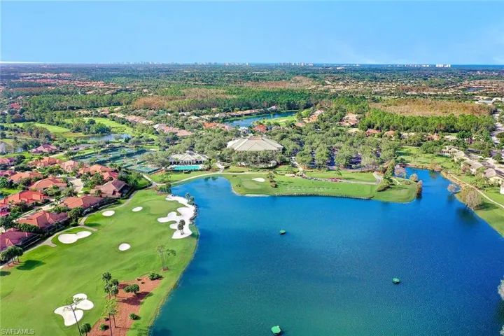 Aerial view with view of golf course, a water view, and a residential view