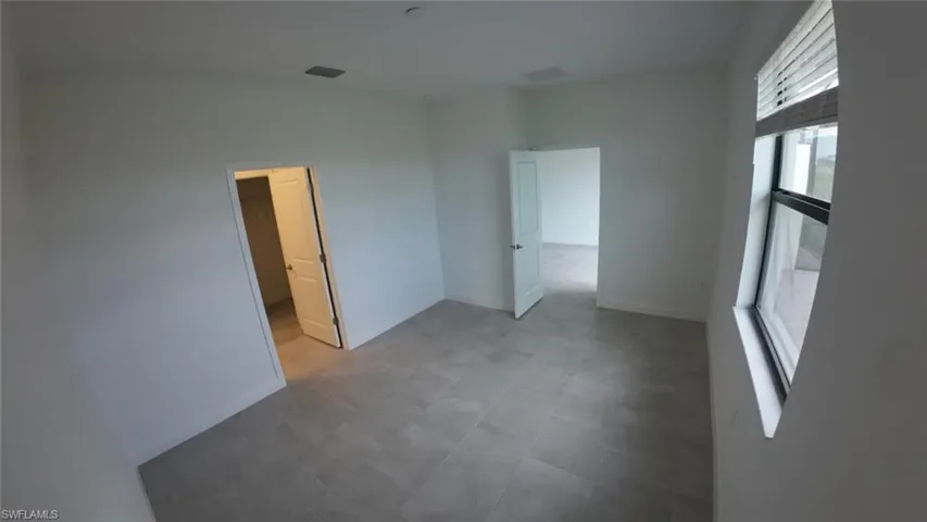 Unfurnished room with baseboards