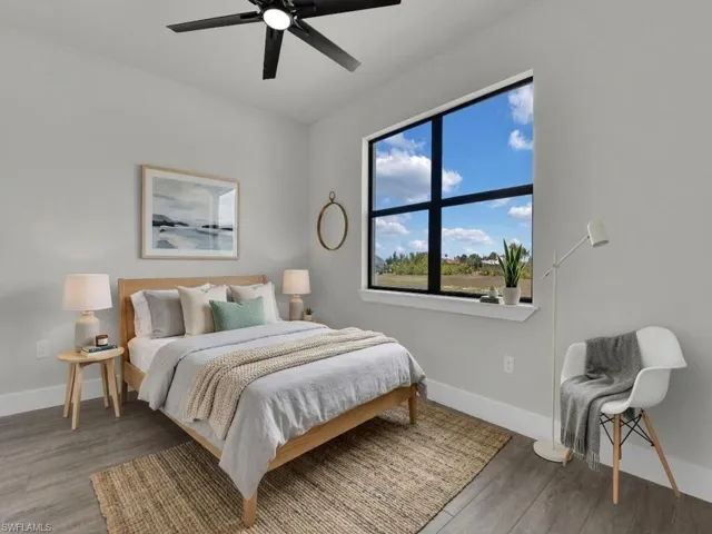 Bedroom with light wood-type flooring and ceiling fan