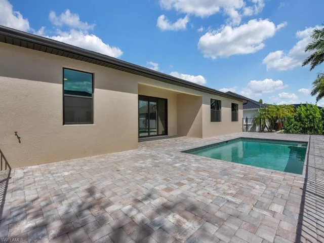 View of swimming pool featuring patio surround