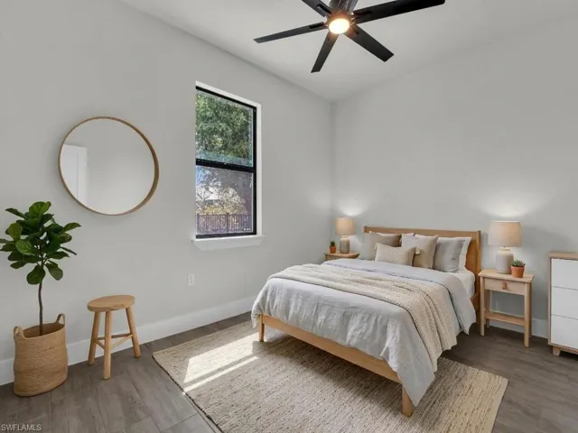 Bedroom featuring wood finished floors and a ceiling fan