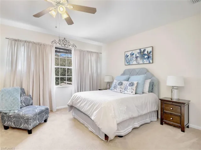 Secondary bedroom featuring ceiling fan
