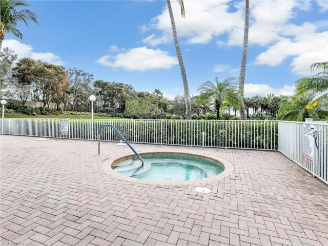 View of pool featuring a hot tub.