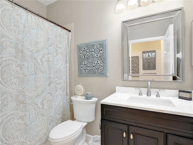 Secondary Bathroom featuring vanity and toilet