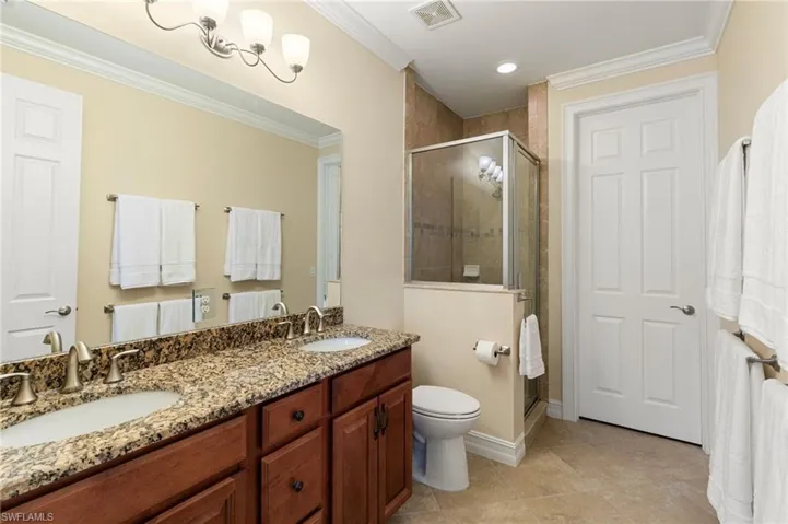 Primary Ensuite Bathroom features granite, dual sinks, walk in shower and plenty of storage!