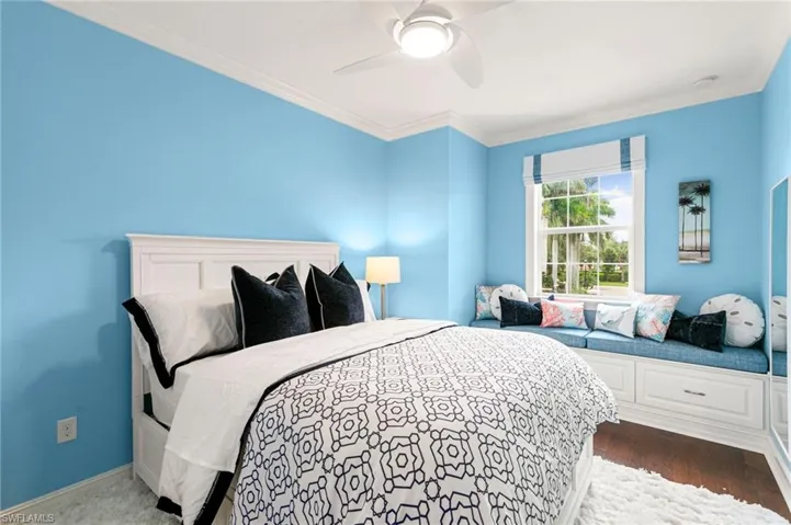 Guest Bed features a built in window seat & customized window treatment.