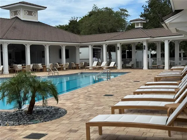 Community pool featuring a patio area