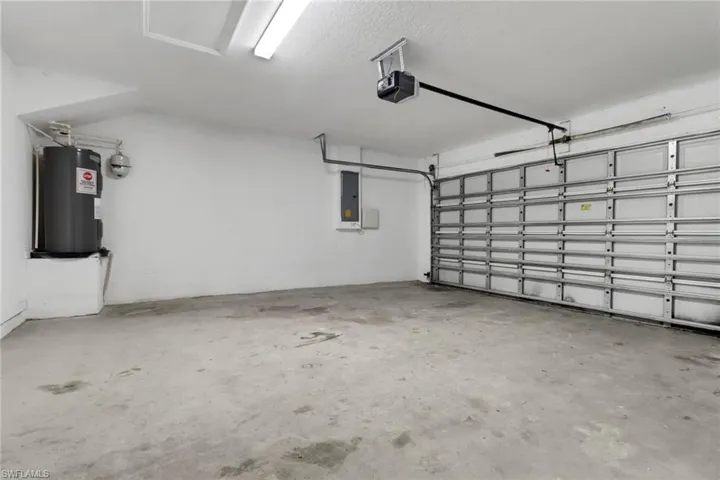 Garage with a garage door opener and water heater