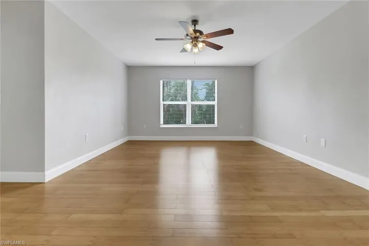 Spare room featuring light hardwood / wood-style floors and ceiling fan