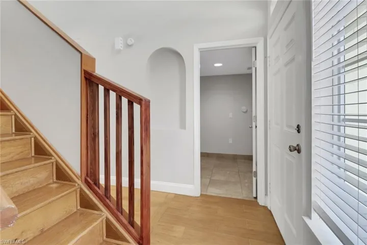 Stairway featuring light hardwood / wood-style floors